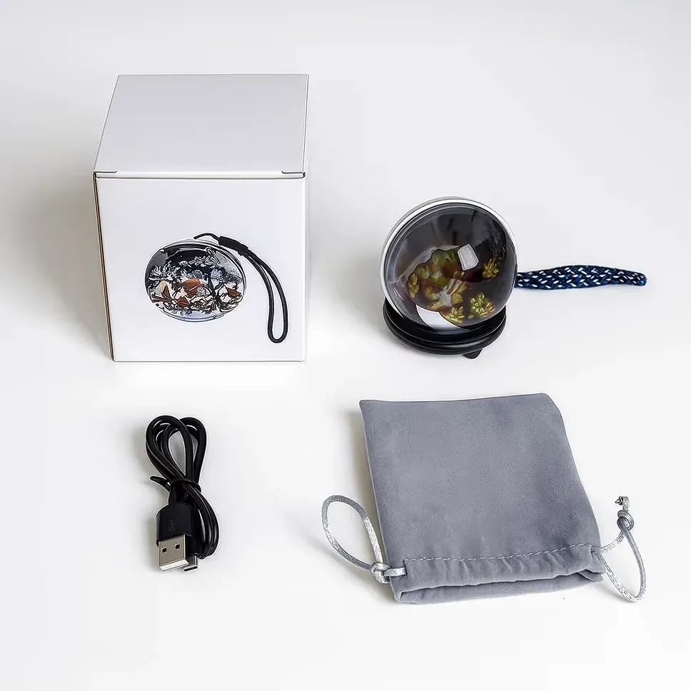 Memory Orb unboxing showing the orb, base and packaging